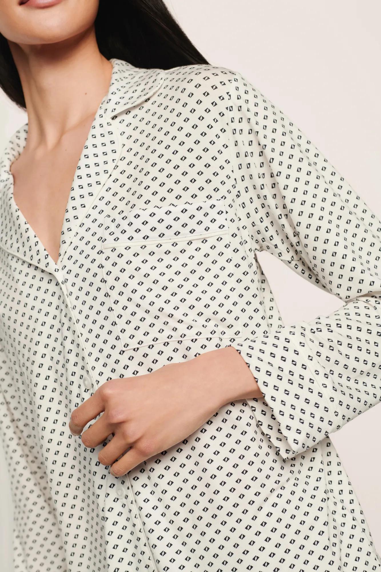 Model is wearing Gisele Printed TENCEL™ Modal Long PJ Set in Tide Dot Ivory/Ivory