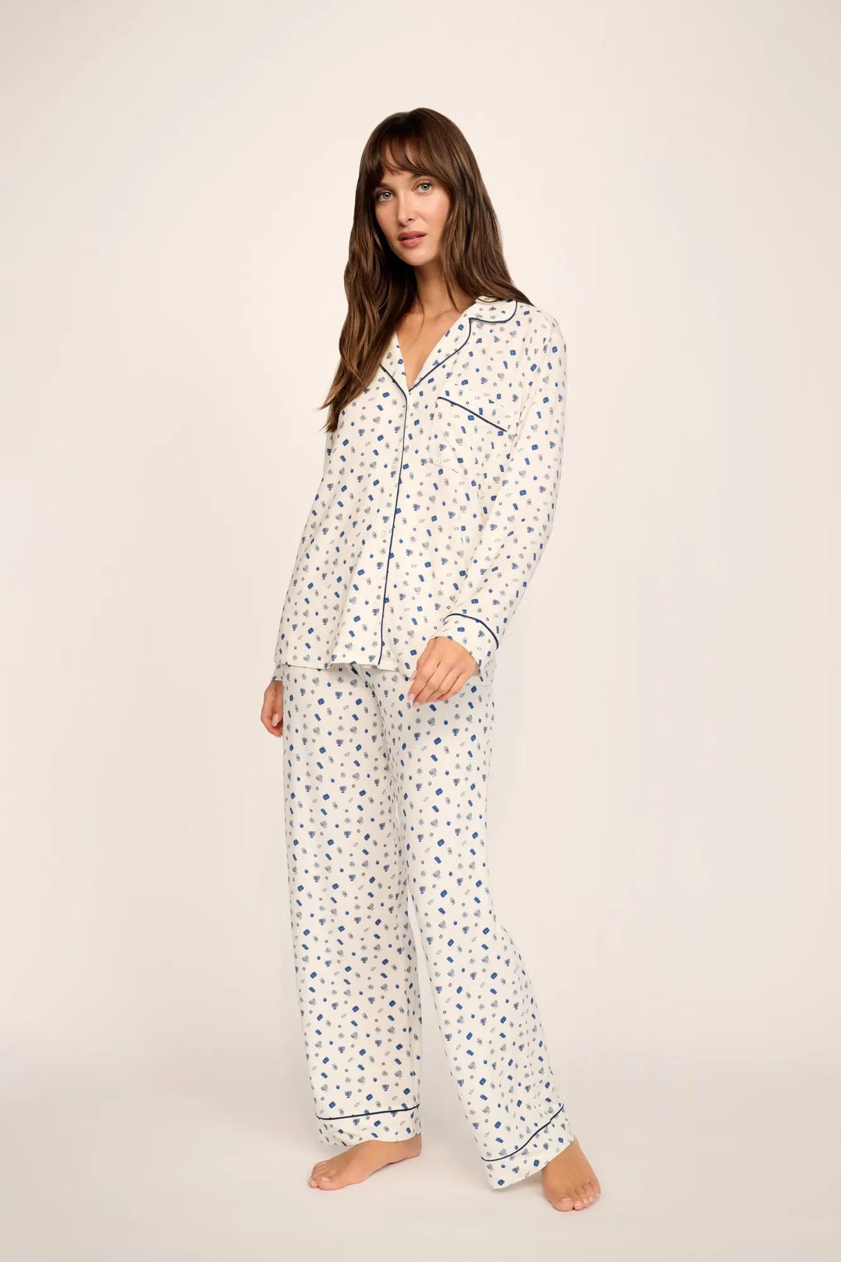 Model is wearing Gisele Printed TENCEL™ Modal Long PJ Set in Twinkling Menorah Ivory/Navy