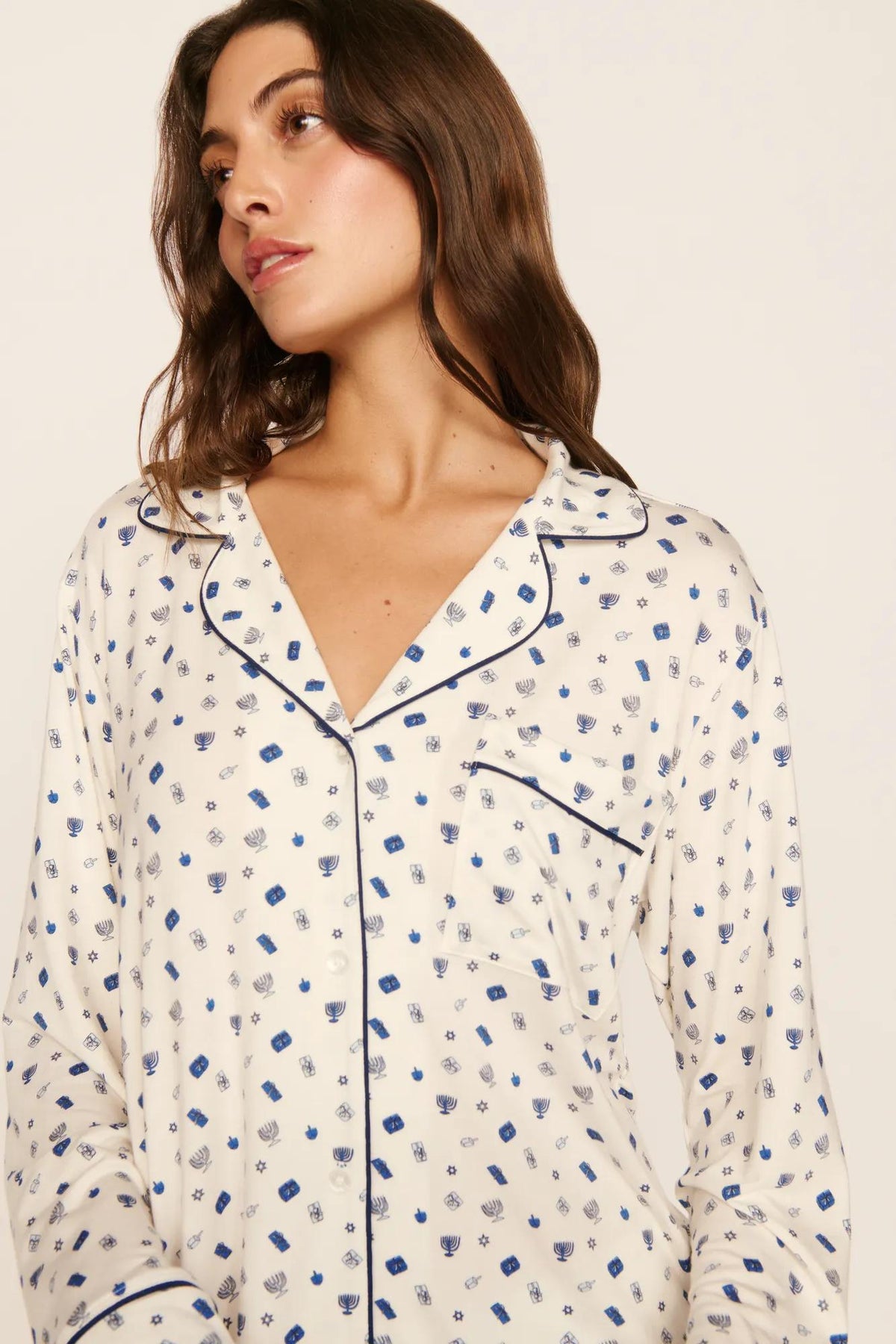 Model is wearing Gisele Printed TENCEL™ Modal Long PJ Set in Twinkling Menorah Ivory/Navy
