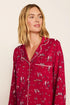 Model is wearing Gisele Printed TENCEL™ Modal Long PJ Set in Winter Skating Holly Red/Ivory