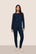 Model is wearing Gisele Printed TENCEL™ Modal Crewneck PJ Set  in Forest Pine Navy/Ivory