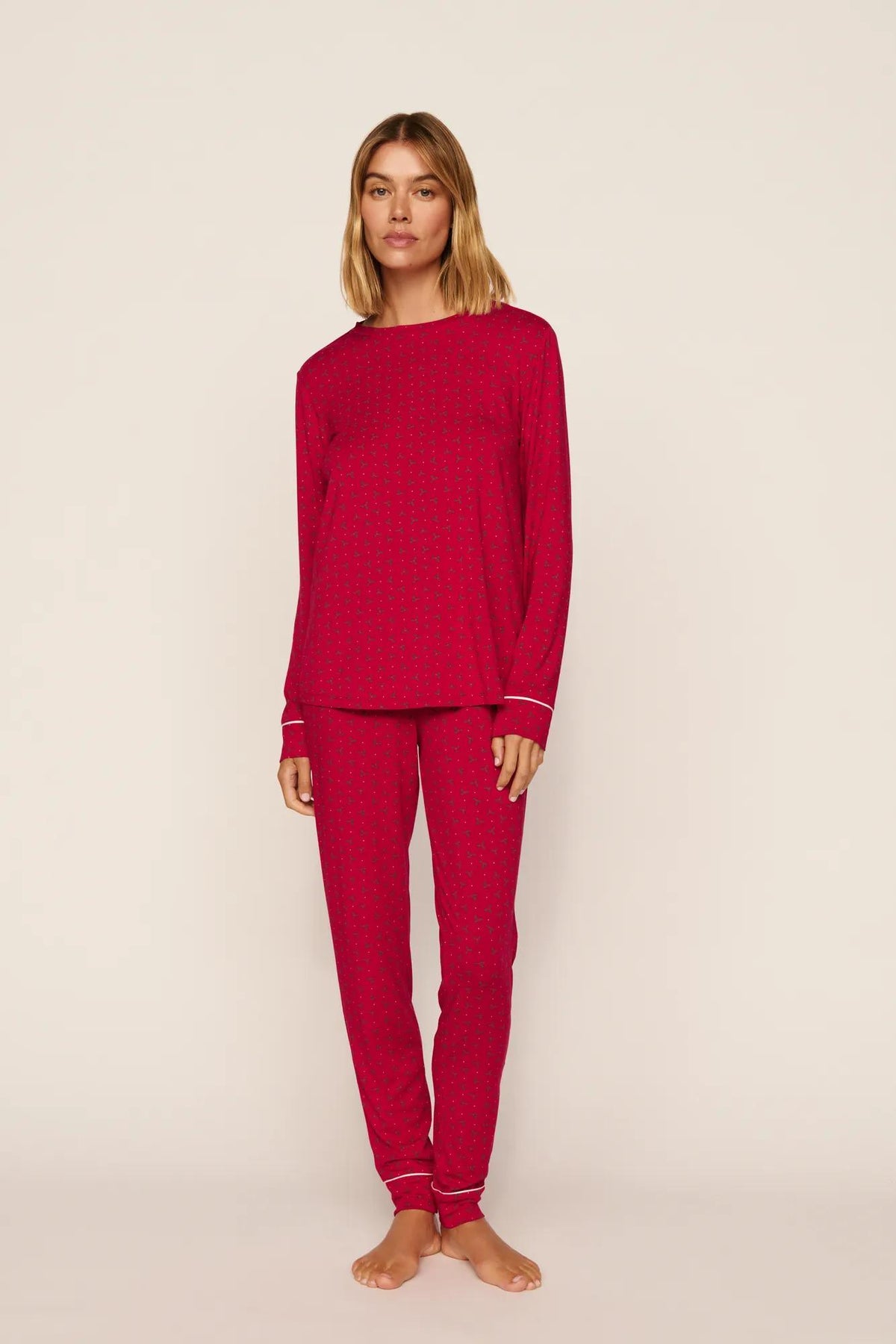 Model is wearing Gisele Printed TENCEL™ Modal Crewneck PJ Set in Hollyberry Holly Red/Ivory