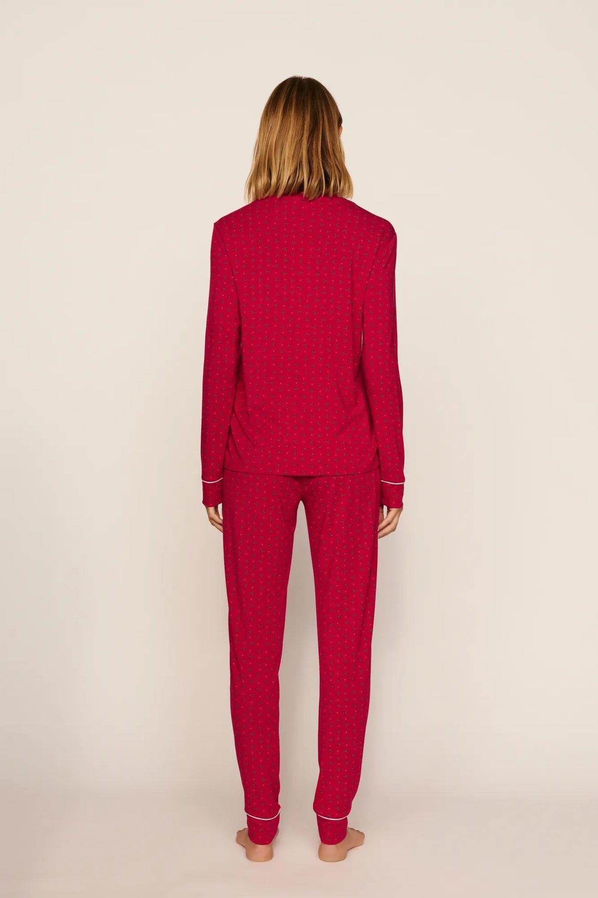 Model is wearing Gisele Printed TENCEL™ Modal Crewneck PJ Set in Hollyberry Holly Red/Ivory