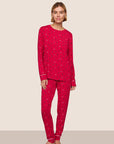 Model is wearing Gisele Printed TENCEL™ Modal Crewneck PJ Set  in Nutcracker Holly Red/Ivory