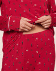 Model is wearing Gisele Printed TENCEL™ Modal Crewneck PJ Set  in Nutcracker Holly Red/Ivory