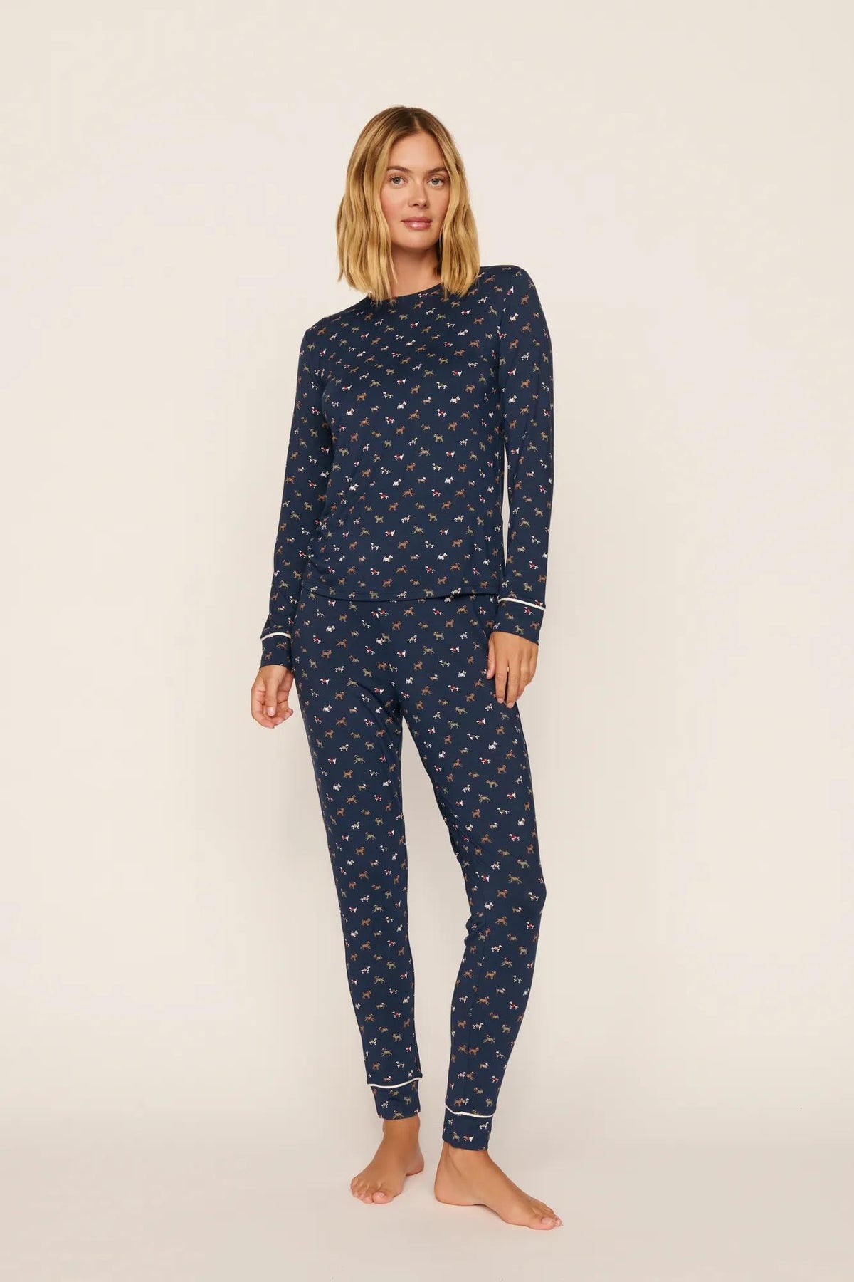 Model is wearing Gisele Printed TENCEL™ Modal Crewneck PJ Set in Santa Paws Navy/Ivory