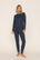 Model is wearing Gisele Printed TENCEL™ Modal Crewneck PJ Set in Santa Paws Navy/Ivory