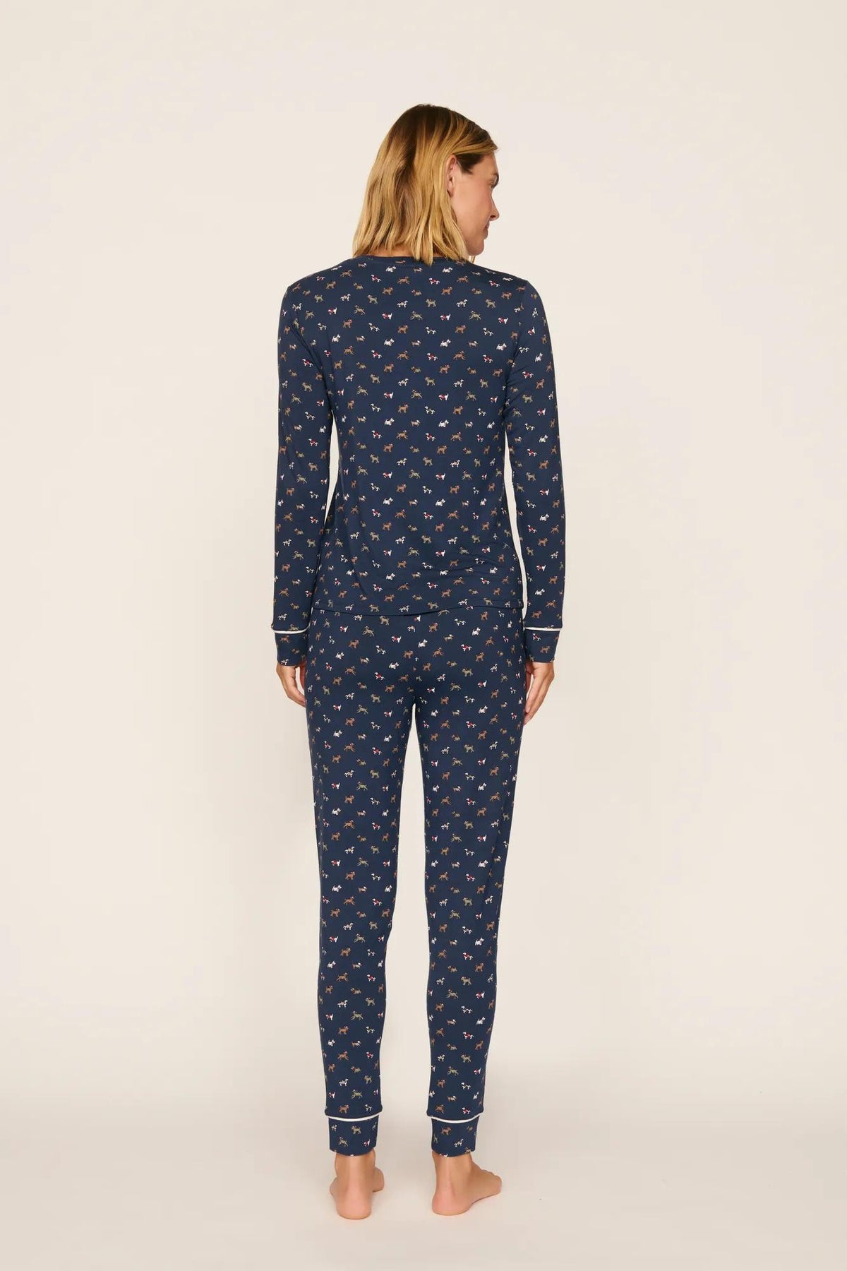 Model is wearing Gisele Printed TENCEL™ Modal Crewneck PJ Set in Santa Paws Navy/Ivory