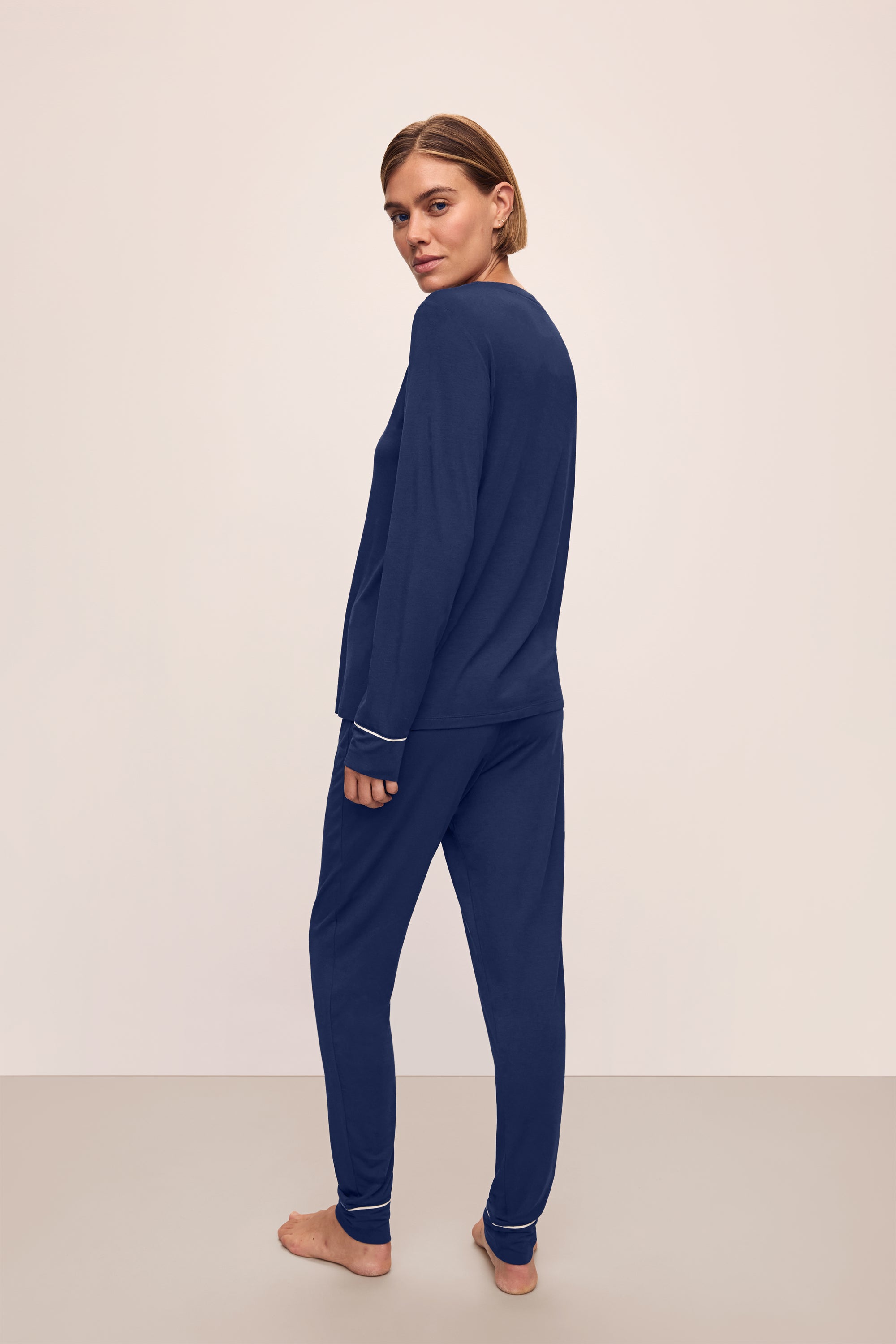 Model is wearing Gisele TENCEL™ Modal Crewneck PJ Set in Navy/Ivory