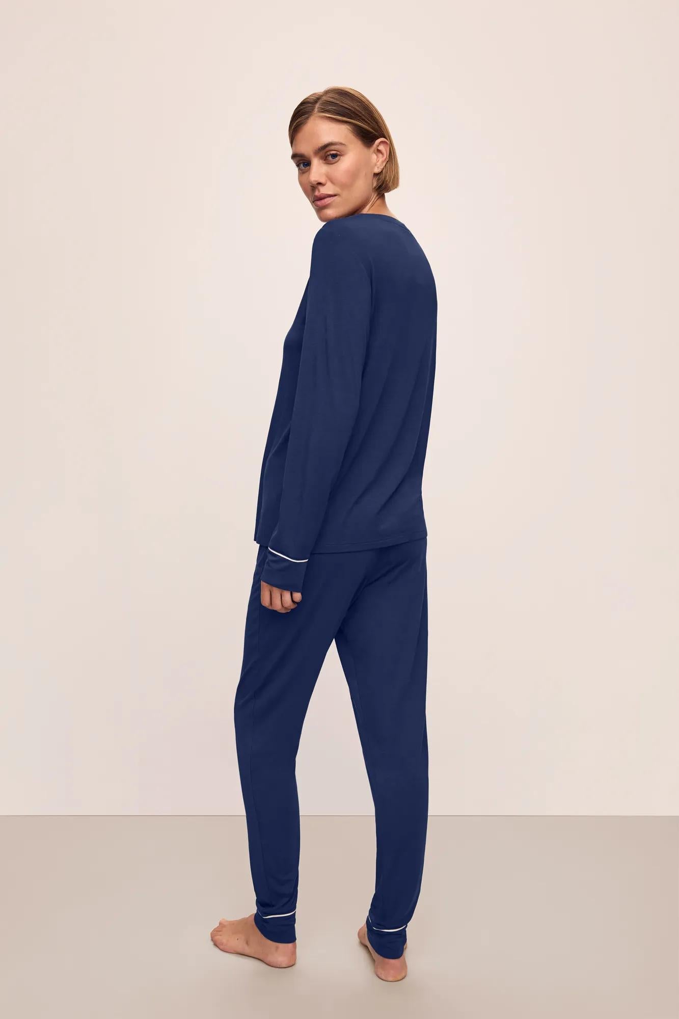 Model is wearing Gisele TENCEL™ Modal Crew Neck PJ Set in Navy/Ivory