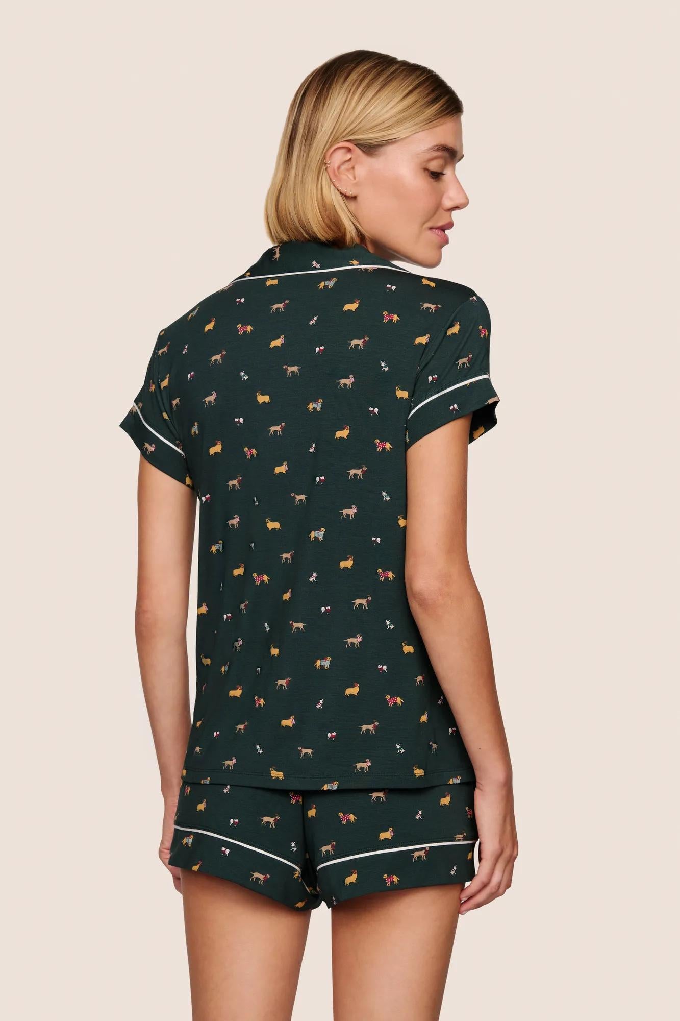 Model is wearing Gisele Printed TENCEL™ Modal Shortie Short PJ Set  in Holiday Dogs Pine/Ivory