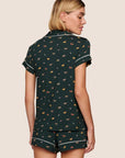 Model is wearing Gisele Printed TENCEL™ Modal Shortie Short PJ Set  in Holiday Dogs Pine/Ivory