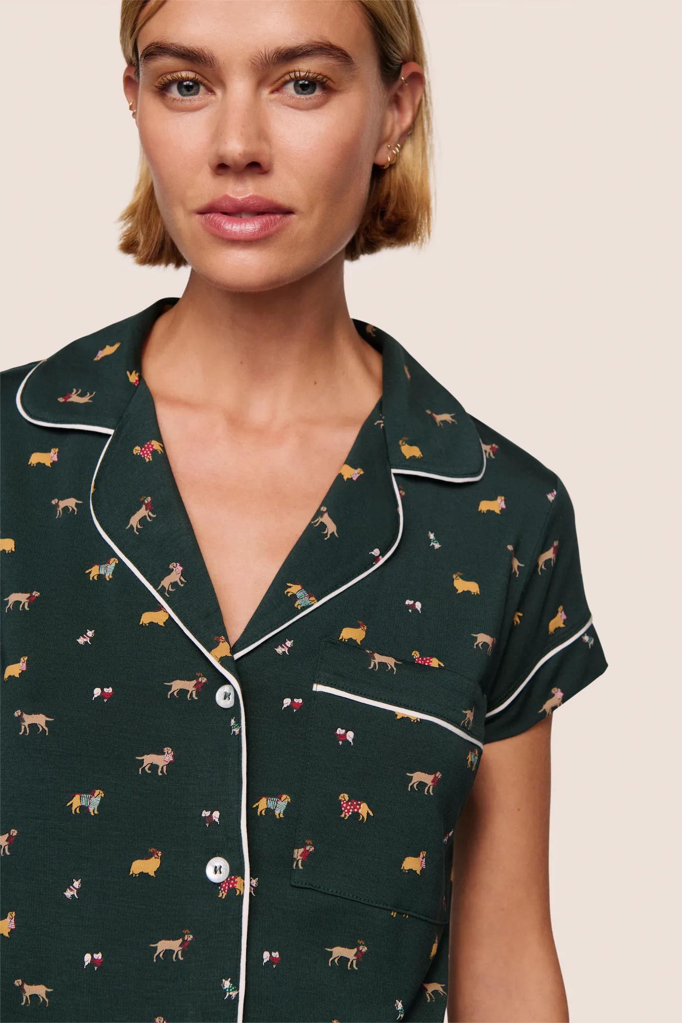 Model is wearing Gisele Printed TENCEL™ Modal Shortie Short PJ Set  in Holiday Dogs Pine/Ivory