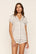 Model is wearing Gisele Printed TENCEL™ Modal Shortie Short PJ Set in On The Slopes Ivory/Navy