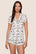 Model is wearing Gisele Printed TENCEL™ Modal Shortie Short PJ Set  in Ski Chalet Ivory/Pine