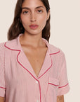 Model is wearing Gisele Printed TENCEL™ Modal Relaxed Short PJ Set  in Duo Stripe Hollyred/Hollyred