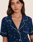 Model is wearing Gisele Printed TENCEL™ Modal Relaxed Short PJ Set  in Forest Pine Navy/Ivory