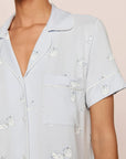 Model is wearing Gisele Printed TENCEL™ Modal Relaxed Short PJ Set in Large Swans Ice Blue/Ivory