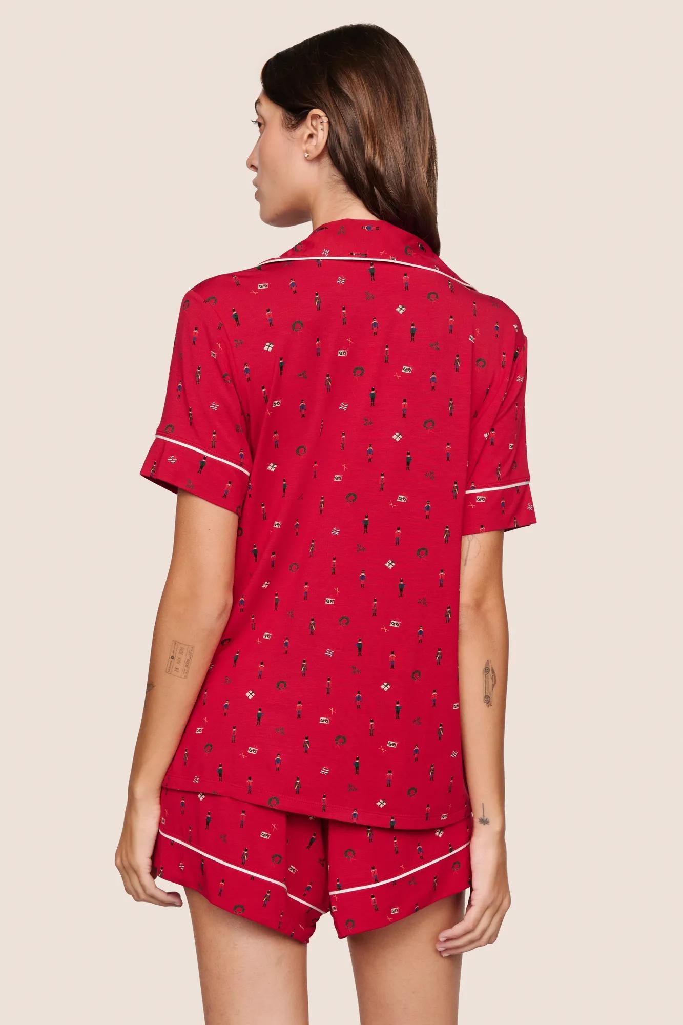 Model is wearing Gisele Printed TENCEL™ Modal Relaxed Short PJ Set  in Nutcracker Holly Red/Ivory