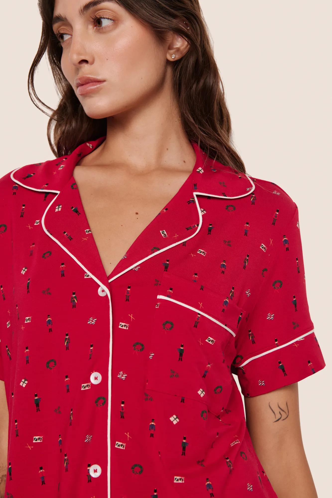 Model is wearing Gisele Printed TENCEL™ Modal Relaxed Short PJ Set  in Nutcracker Holly Red/Ivory