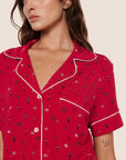 Model is wearing Gisele Printed TENCEL™ Modal Relaxed Short PJ Set  in Nutcracker Holly Red/Ivory
