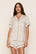 Model is wearing Gisele Printed TENCEL™ Modal Relaxed Short PJ Set in On The Slopes Ivory/Navy