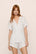 Model is wearing Gisele Printed TENCEL™ Modal Relaxed Short PJ Set in SummerDaisyWhite/PaleMauve