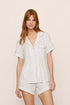 Model is wearing Gisele Printed TENCEL™ Modal Relaxed Short PJ Set in SummerDaisyWhite/PaleMauve