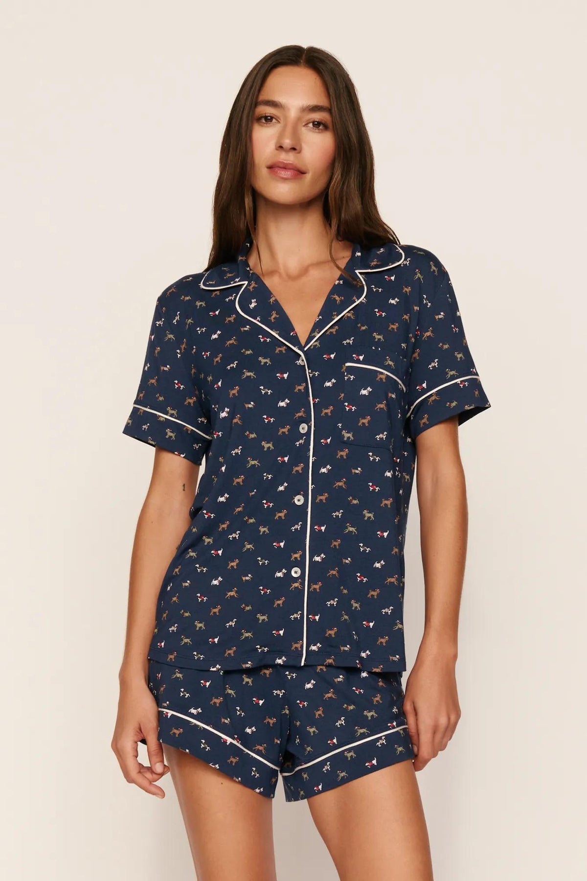 Model is wearing Gisele Printed TENCEL™ Modal Relaxed Short PJ Set in Santa Paws Navy/Ivory