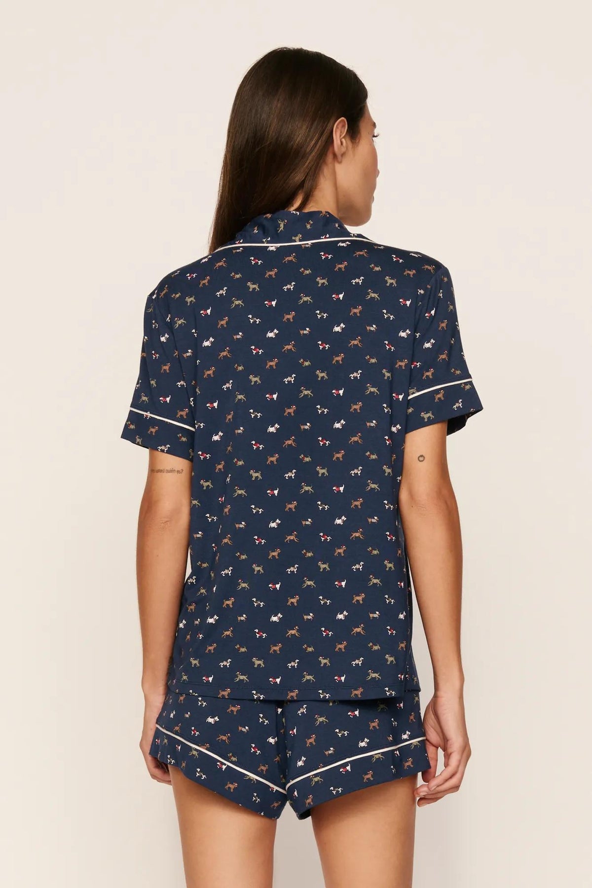 Model is wearing Gisele Printed TENCEL™ Modal Relaxed Short PJ Set in Santa Paws Navy/Ivory