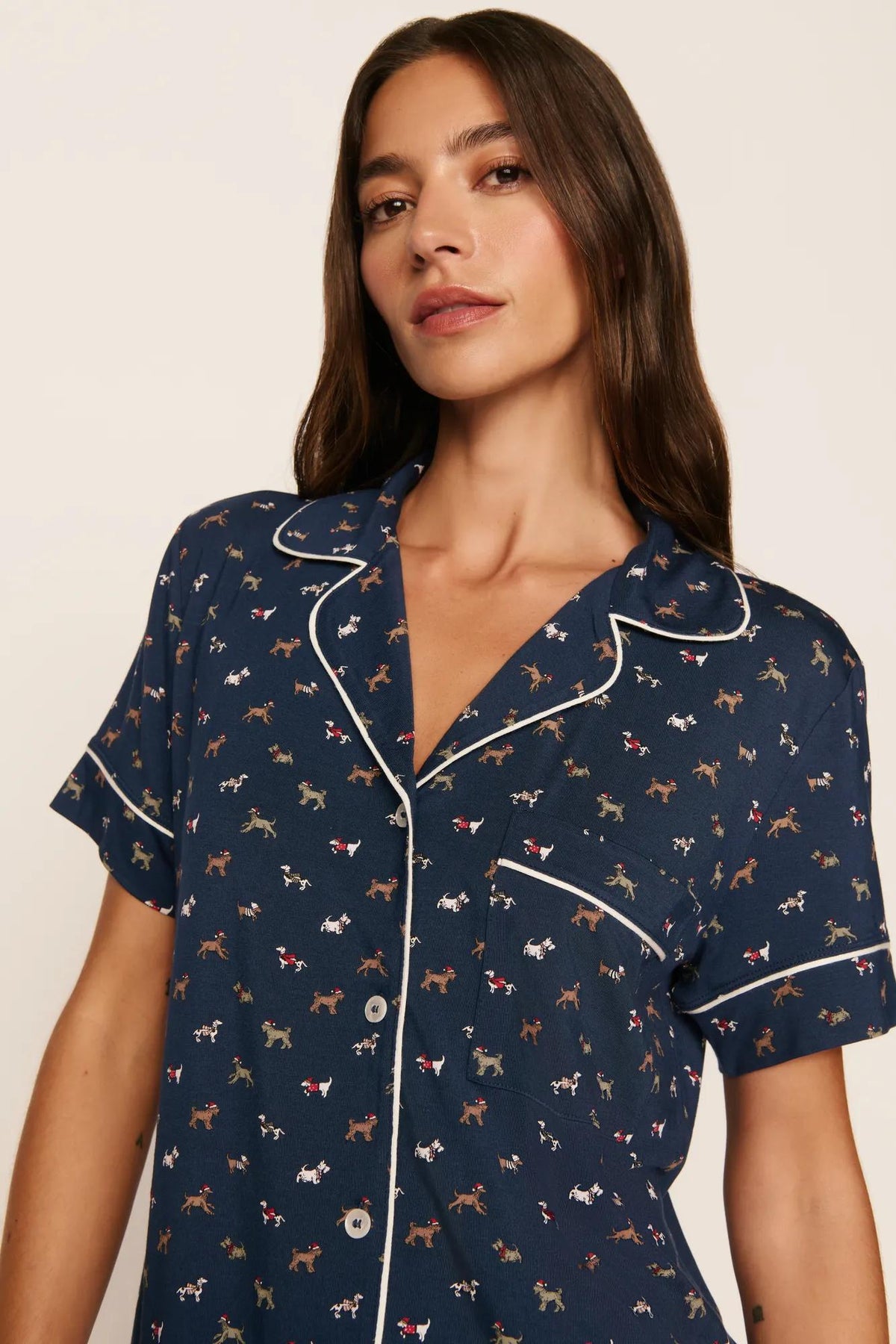Model is wearing Gisele Printed TENCEL™ Modal Relaxed Short PJ Set in Santa Paws Navy/Ivory