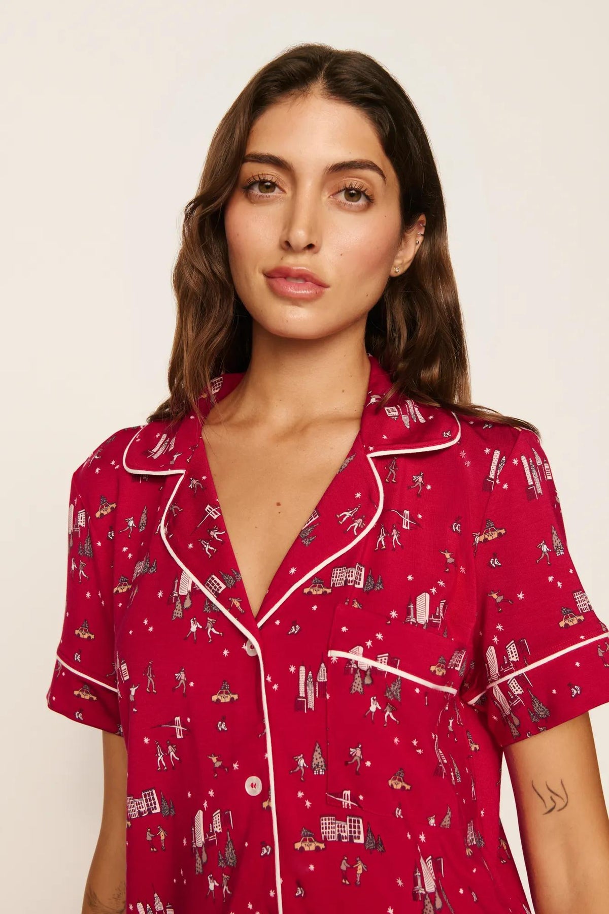 Model is wearing Gisele Printed TENCEL™ Modal Relaxed Short PJ Set in Winter Skating Holly Red/Ivory