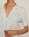 Model is wearing Gisele Printed TENCEL™ Modal Short Sleeve Pant PJ Set in Tide Dot Ivory/Ivory