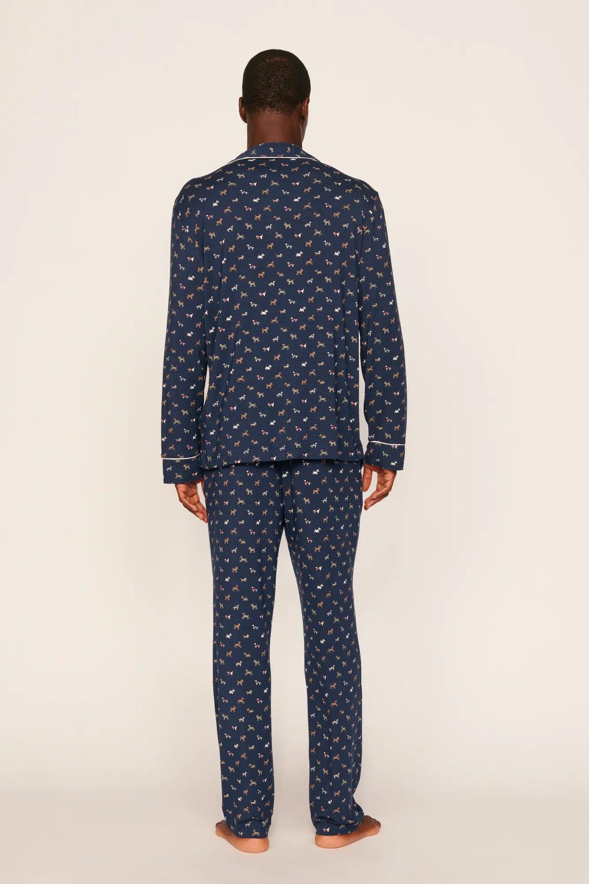 Model is wearing William Printed TENCEL™ Modal Long PJ Set in Santa Paws Navy/Ivory