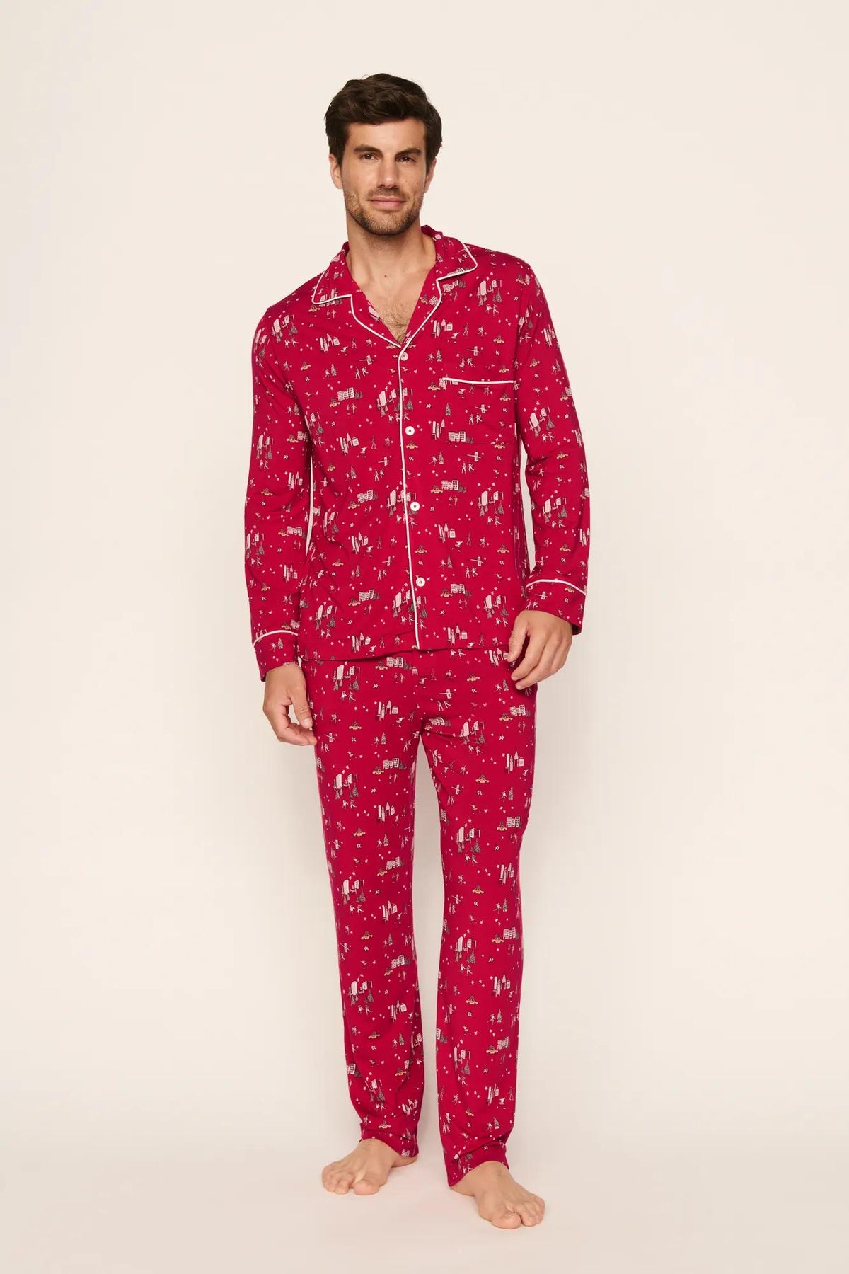 Model is wearing William Printed TENCEL™ Modal Long PJ Set in Winter Skating Holly Red/Ivory