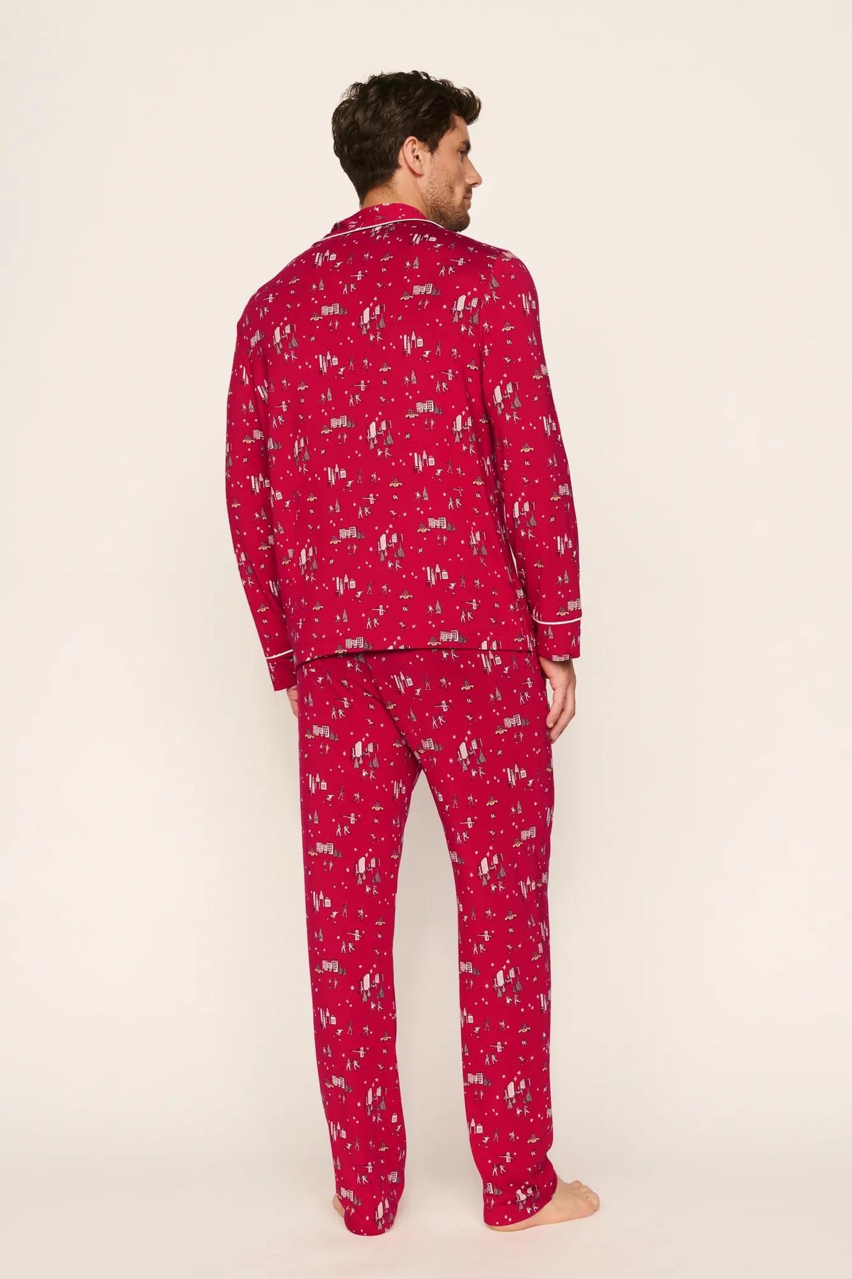 Model is wearing William Printed TENCEL™ Modal Long PJ Set in Winter Skating Holly Red/Ivory