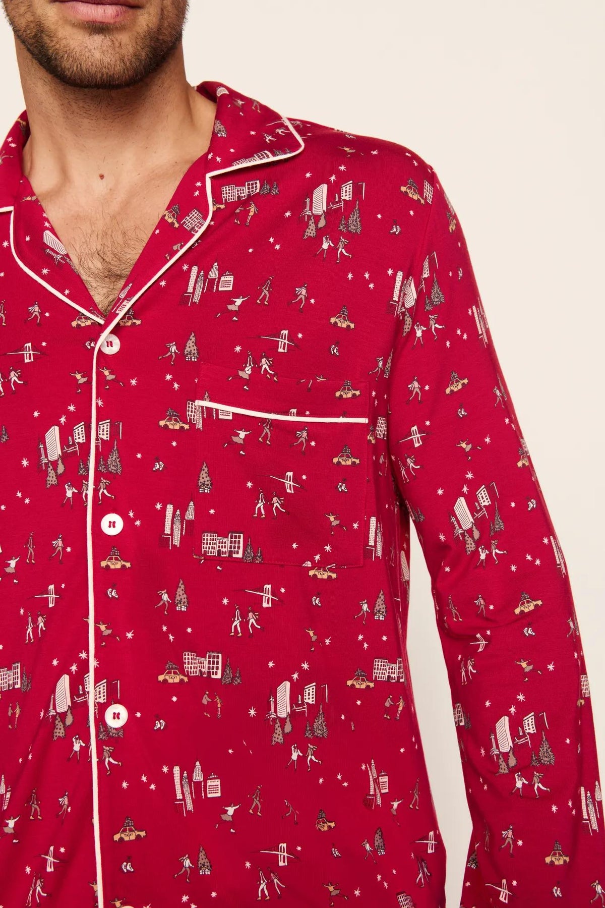Model is wearing William Printed TENCEL™ Modal Long PJ Set in Winter Skating Holly Red/Ivory