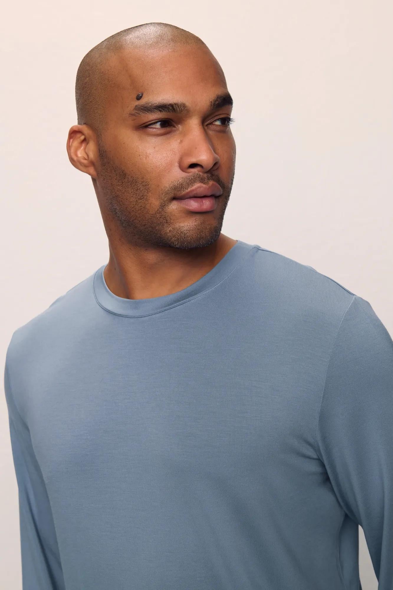 Model is wearing Henry TENCEL™ Modal Long Sleeve Crew PJ Set in Faded Denim