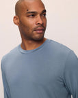 Model is wearing Henry TENCEL™ Modal Long Sleeve Crew PJ Set in Faded Denim