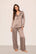 Model is wearing Inez Washable Silk Printed Long PJ Set in Animal Instinct Deep Taupe/Chocolate