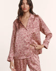 Model is wearing Inez Washable Silk Printed Long PJ Set in Bloomscape Misty Rose/Mesa Rose
