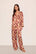 Model is wearing Inez Washable Silk Printed Long PJ Set in Botanical Flower Merlot/Merlot
