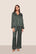 Model is wearing Inez Washable Silk Printed Long PJ Set  in Classic Stripe Pine/Ivory