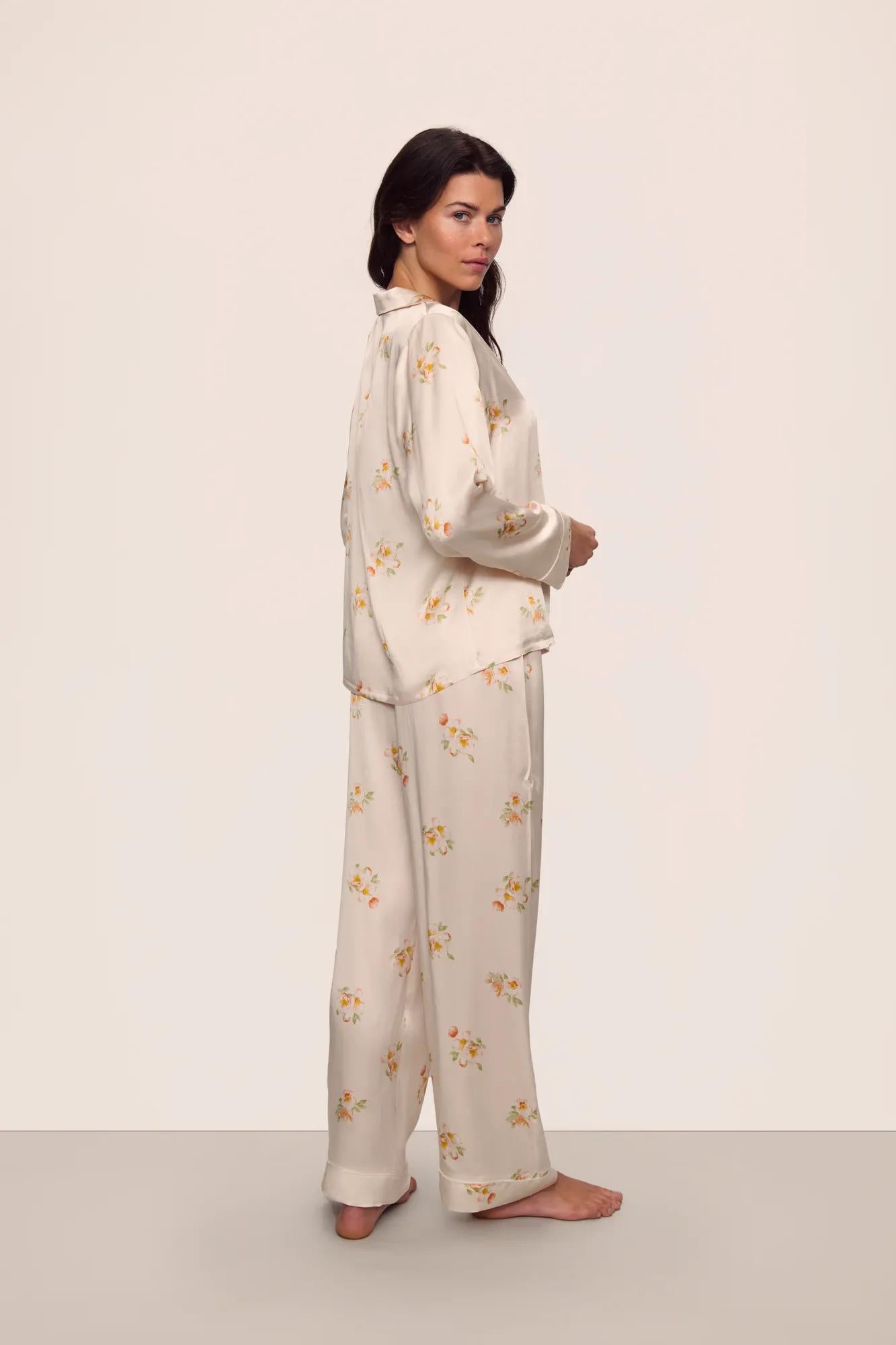 Model is wearing Inez Washable Silk Printed Long PJ Set in  Floral Bloom Peach Dust/Ivory