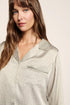 Model is wearing Inez Washable Silk Printed Long PJ Set  in  Geo Mod Desert Sage/Desert Sag