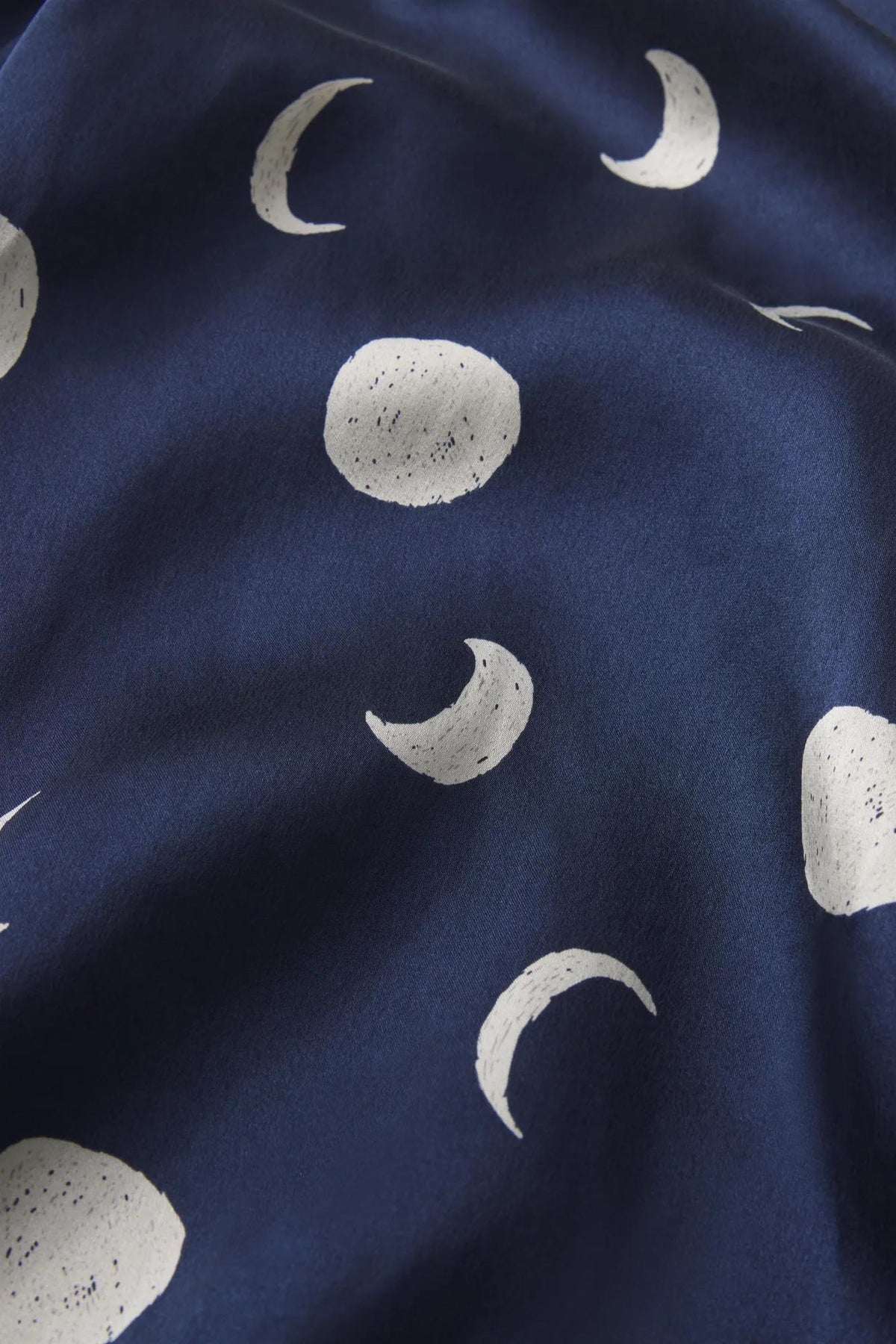 Model is wearing Inez Washable Silk Printed Long PJ Set in Moonlight Navy/Ivory