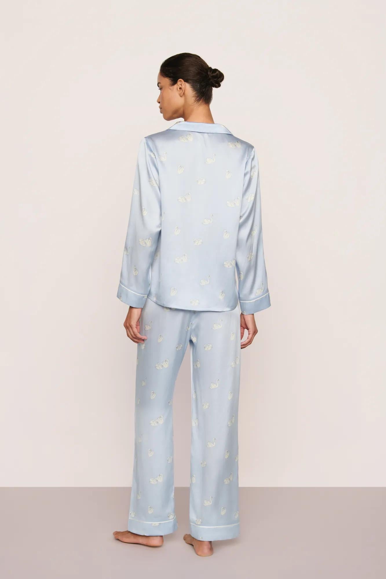Model is wearing Inez Washable Silk Printed Long PJ Set in Large Swans Powder Blue/Ivory