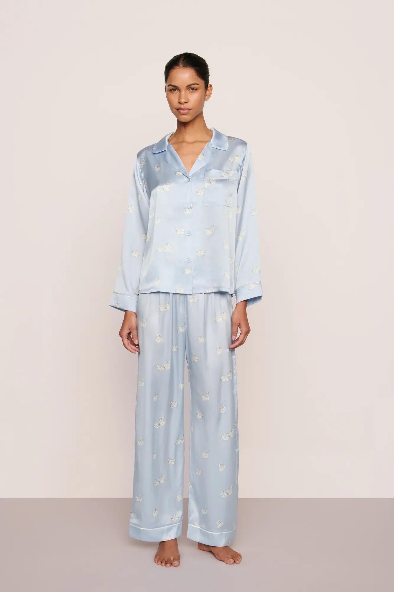 Model is wearing Inez Washable Silk Printed Long PJ Set in Large Swans Powder Blue/Ivory
