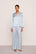 Model is wearing Inez Washable Silk Printed Long PJ Set in Large Swans Powder Blue/Ivory