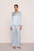 Model is wearing Inez Washable Silk Printed Long PJ Set in Large Swans Powder Blue/Ivory